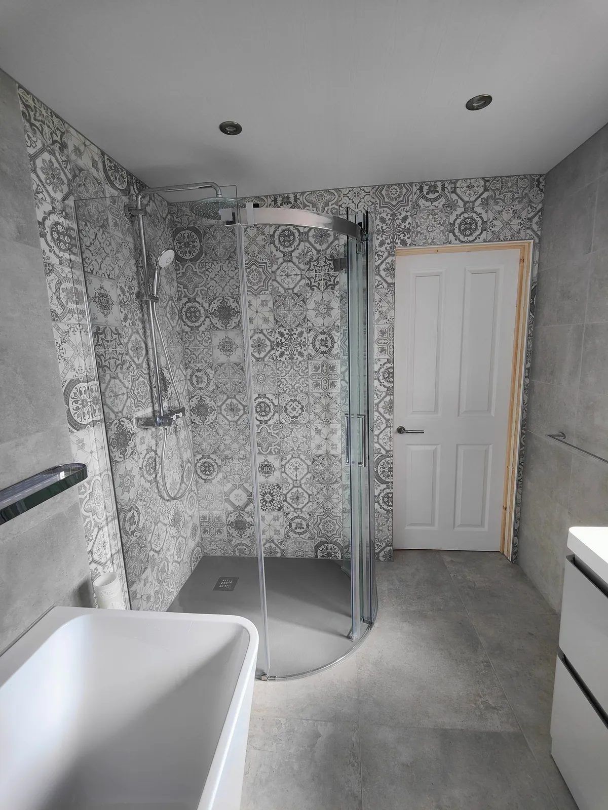 Renovated bathroom with quadrant shower and freestanding bath