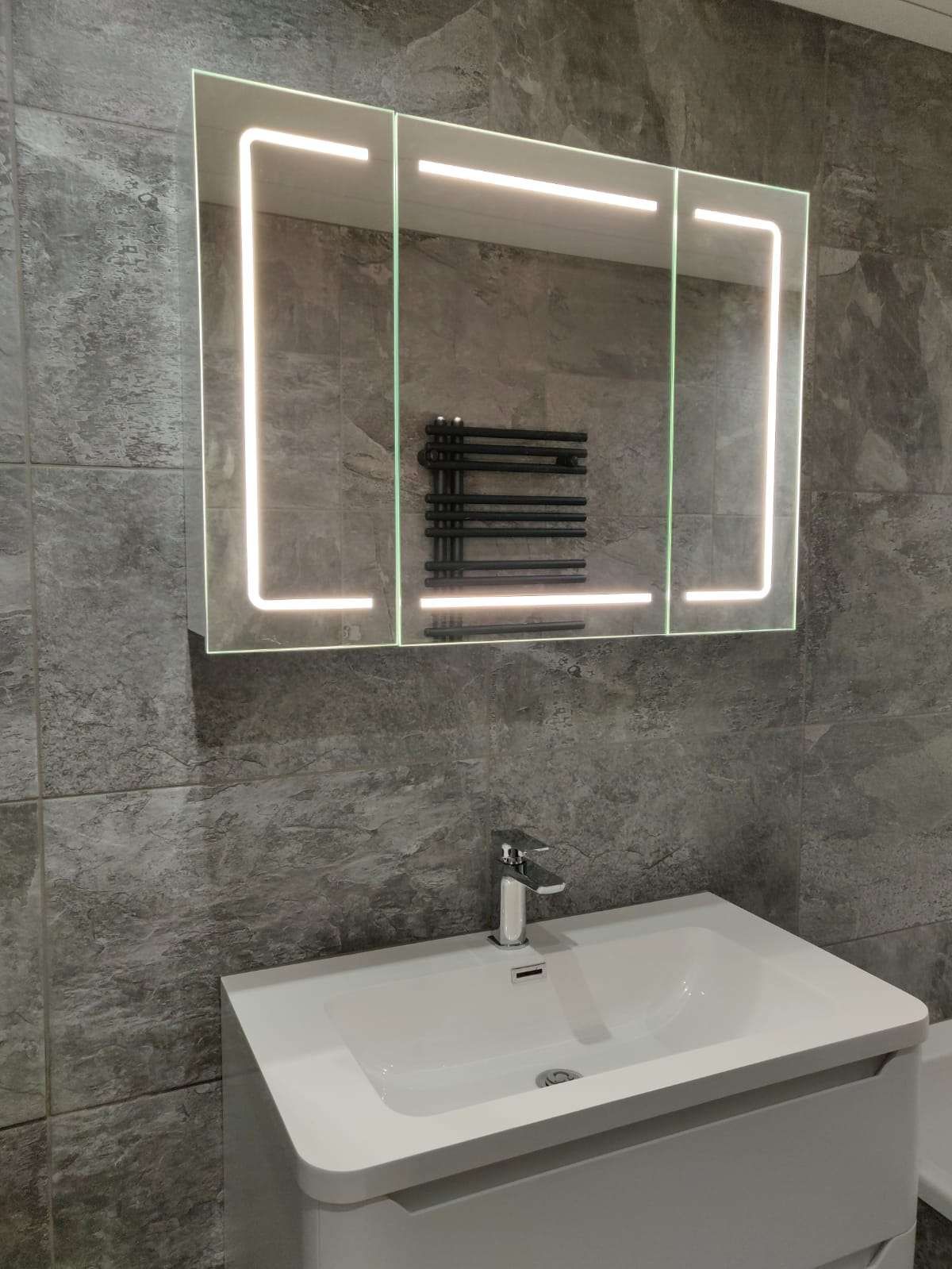 Bathroom with LED mirror and black heated towel rail