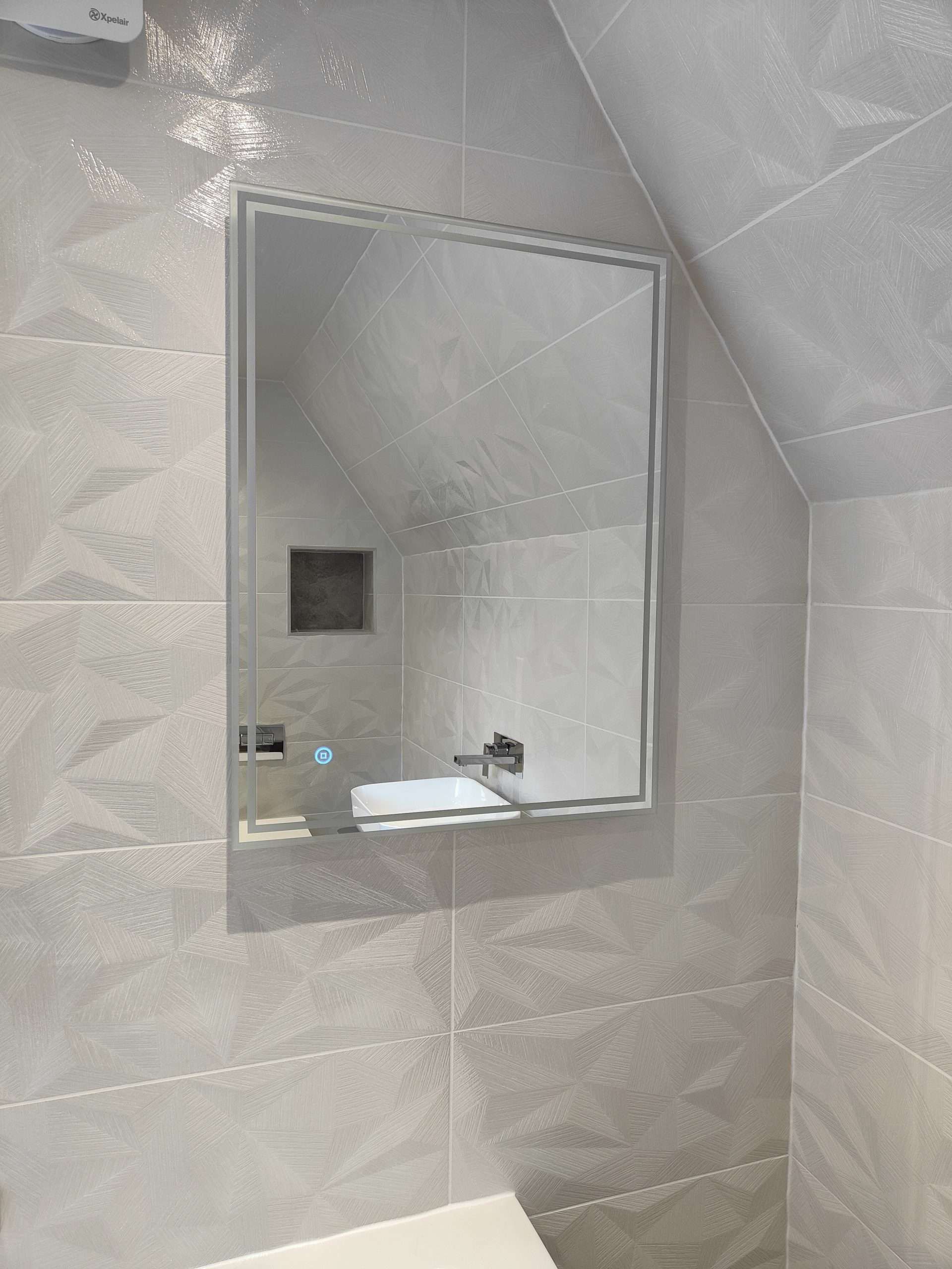 Textured feature wall with tiled shower niche